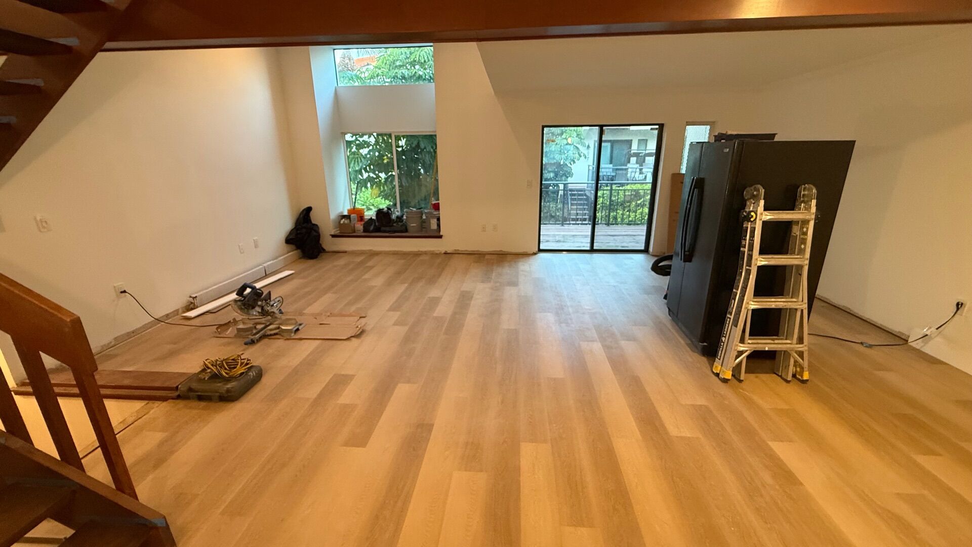 Living room and kitchen with new wood-look flooring