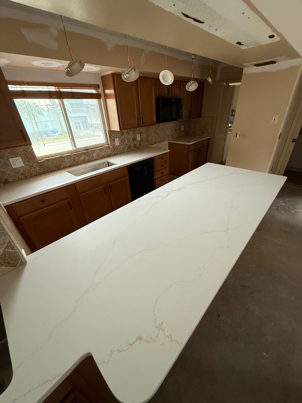 Kitchen remodel with quartz countertops and large island
