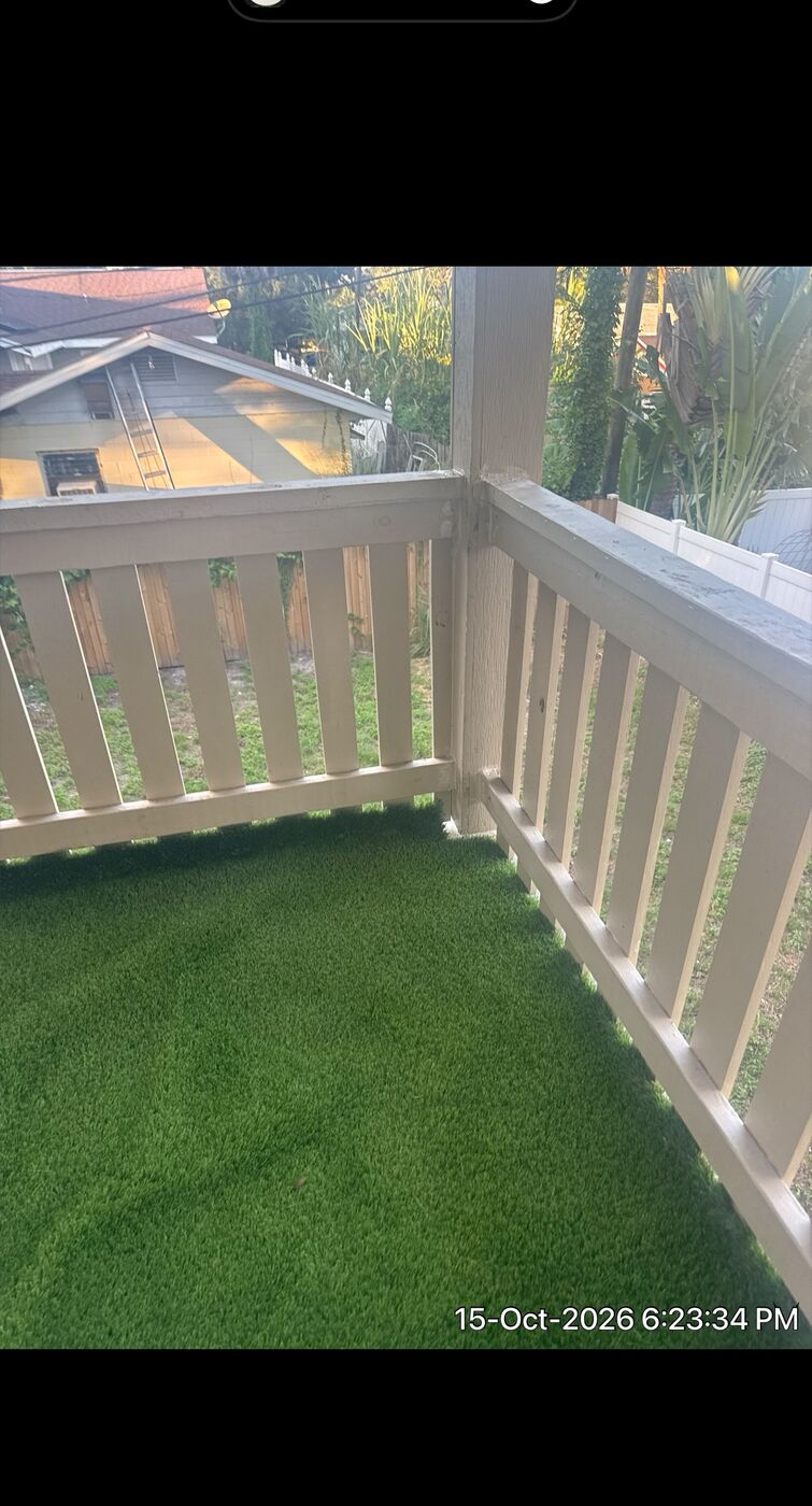 Covered porch with new artificial turf